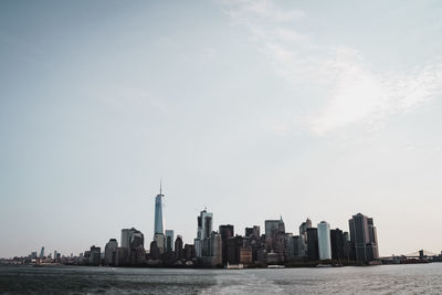 Sea and buildings against sky