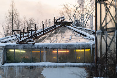 Old greenhouse with phyto lamps or led lighting for plant growth during winter