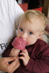 Portrait of cute baby girl holding ice cream