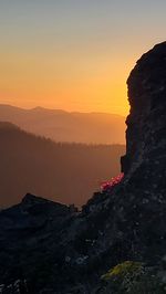 Scenic view of silhouette mountain against sky during sunset