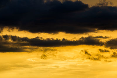 Low angle view of dramatic sky during sunset