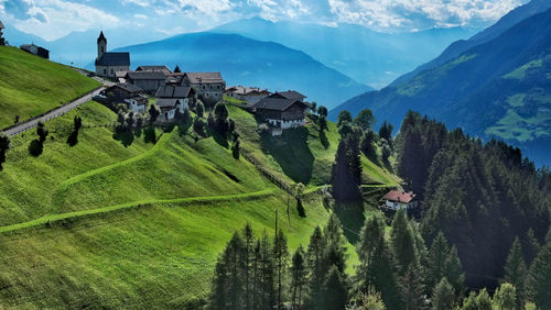 Panoramic shot of trees and buildings against sky