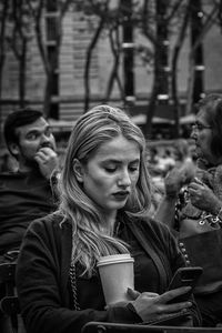 Close-up of a young woman drinking water