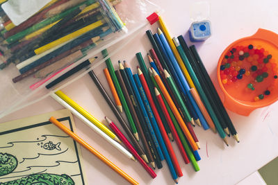 High angle view of multi colored pencils on table