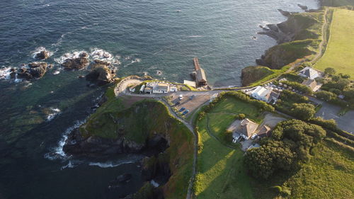 High angle view of sea and buildings