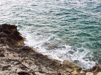 Scenic view of waves breaking on shore