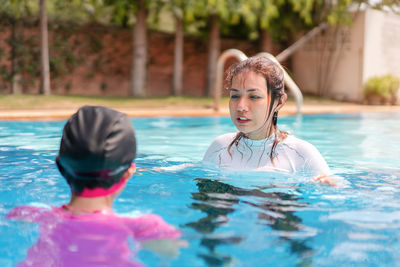 View of people swimming in pool