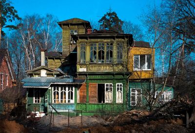 Exterior of abandoned house against sky