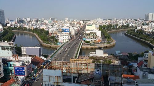 View of cityscape with river in foreground