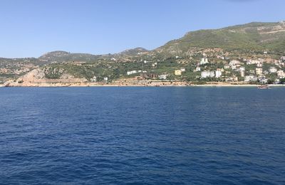 Scenic view of sea against clear blue sky