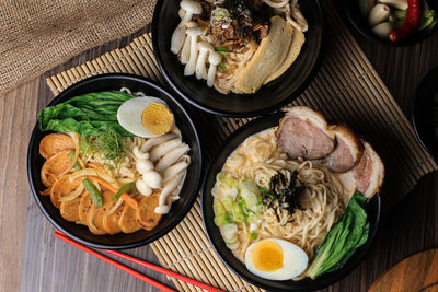 High angle view japanese ramen noodles with some delicious types served on table