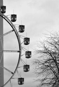 Low angle view of ferris wheel against sky