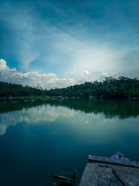 Scenic view of lake against blue sky