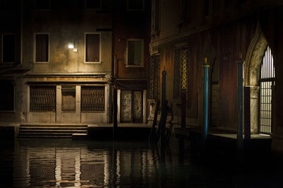 Empty illuminated building in city at night