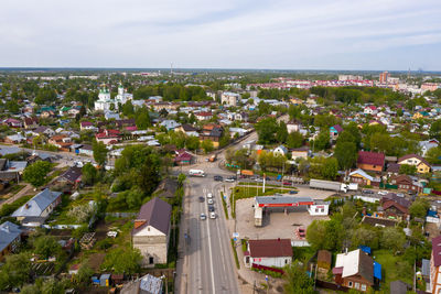 High angle view of trees and buildings against sky