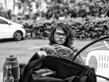 Portrait of man sitting in car