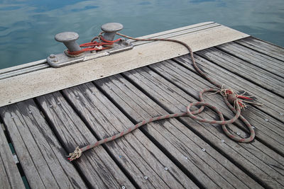 High angle view of rope tied to pier