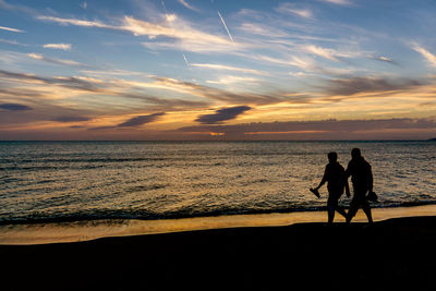 Scenic view of sea at sunset