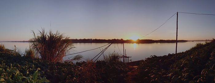 Scenic view of lake at sunset