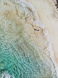 High angle view of surf on beach
