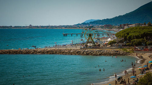 Scenic view of sea and ferris wheel