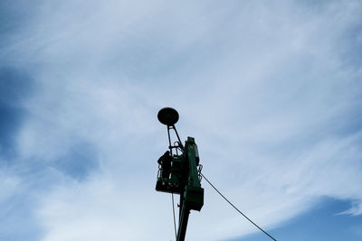 Low angle view of power line against sky