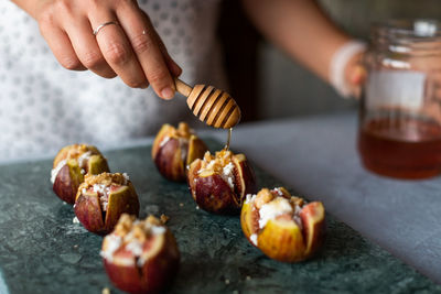 Midsection of person preparing food on table