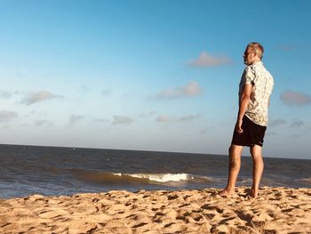 Man by the sea enjoying the late afternoon