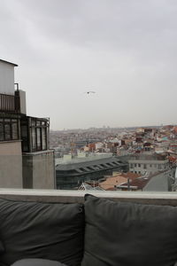 View of buildings in city against sky