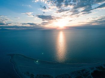 Scenic view of sea against sky at sunset