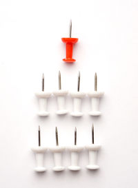 Close-up of candles on table against white background