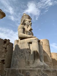 Low angle view of statue against sky