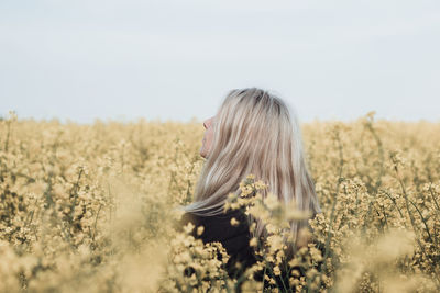 Woman standing in the field