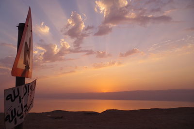 Scenic view of beach against sky during sunset