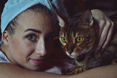 Portrait of man with cat