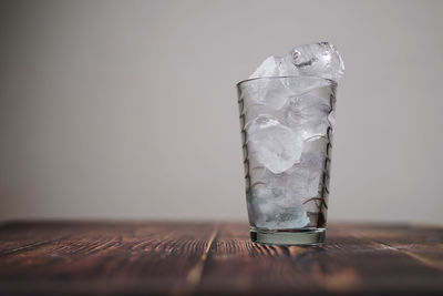 Close-up of ice cream on glass table