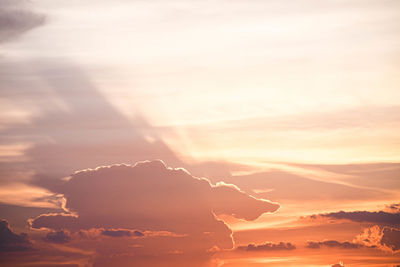 Beautiful sunset sky above clouds orange sunset sky.