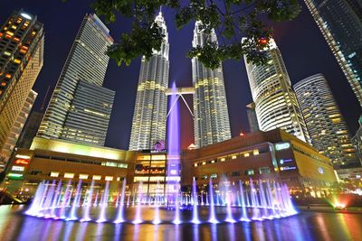 Low angle view of illuminated buildings at night