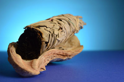 Close-up of chocolate against blue background