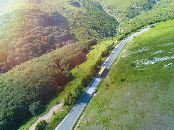 High angle view of road amidst trees