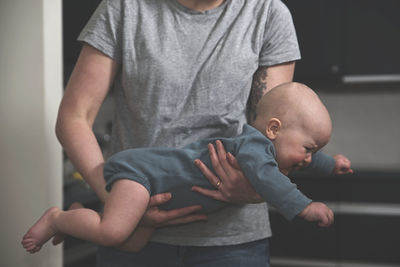 Mother playing with baby