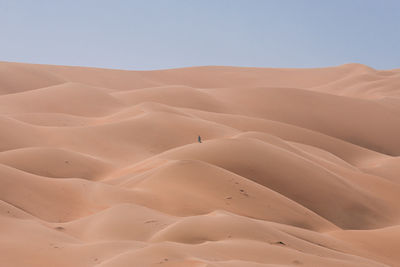 Scenic view of desert against clear sky