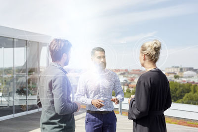 Business people having coffee break on rooftop