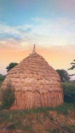 Scenic view of land against sky during sunset