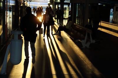 People walking on sidewalk in city