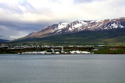 Scenic view of mountains against cloudy sky