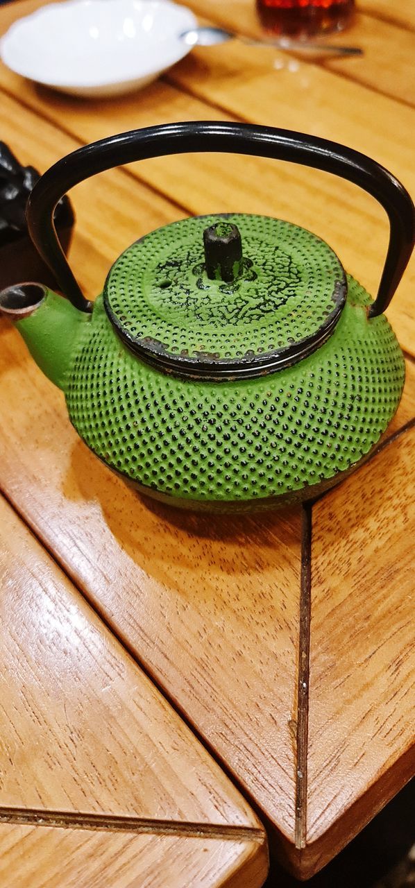 green, wood, teapot, food and drink, table, indoors, art, no people, high angle view, food, kitchen utensil, tableware, still life, wellbeing, household equipment, tea, healthy eating, close-up, freshness