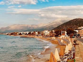 Town by buildings in city against sky