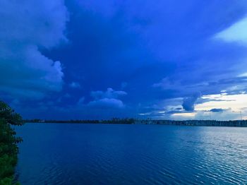 Scenic view of sea against blue sky