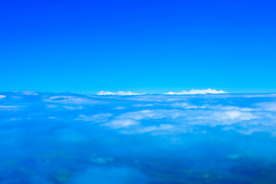 Scenic view of landscape against blue sky